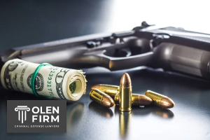 The legality of purchasing firearms for another person