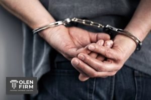 a person cuffed behind for serious DUI charge