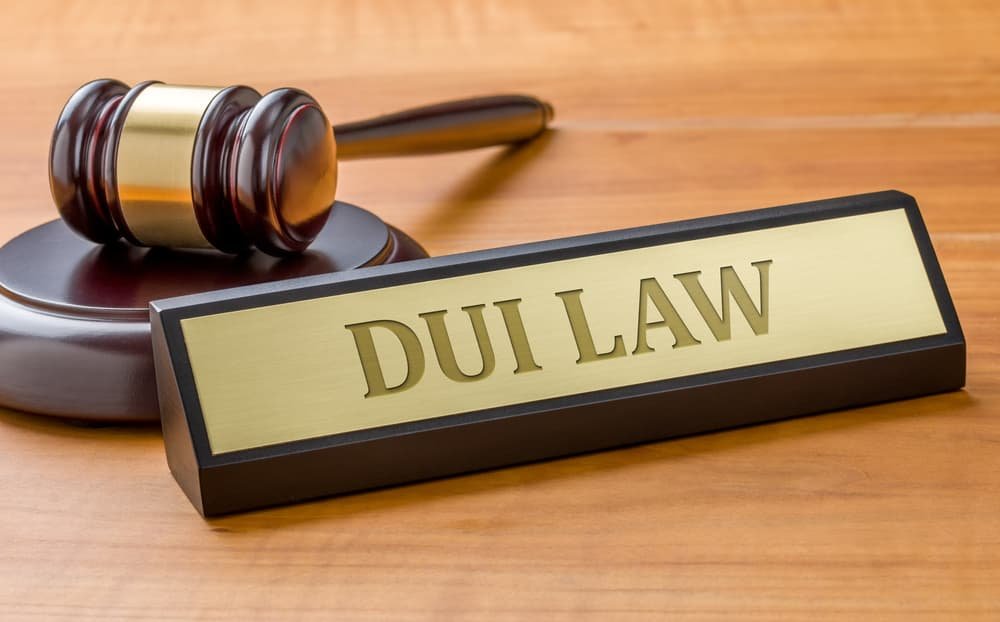 A gavel alongside a nameplate engraved with "DUI Law."