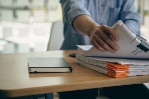 Reviewing case documents to establish sufficient evidence in a Pasadena spousal abuse attorney case.